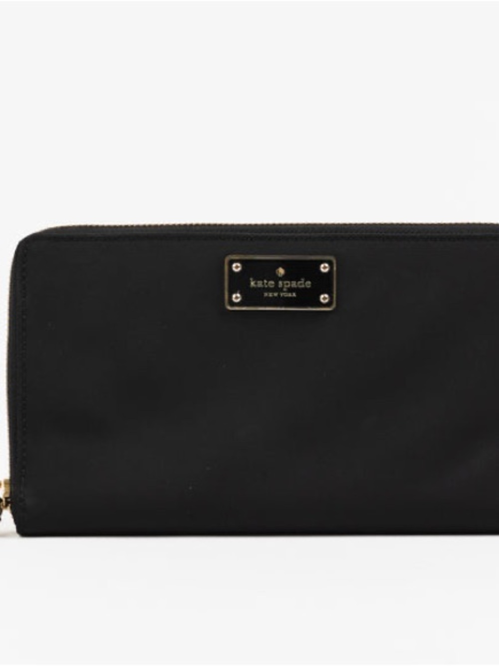 Kate Spade New York zip-around wallet with a gold-tone logo